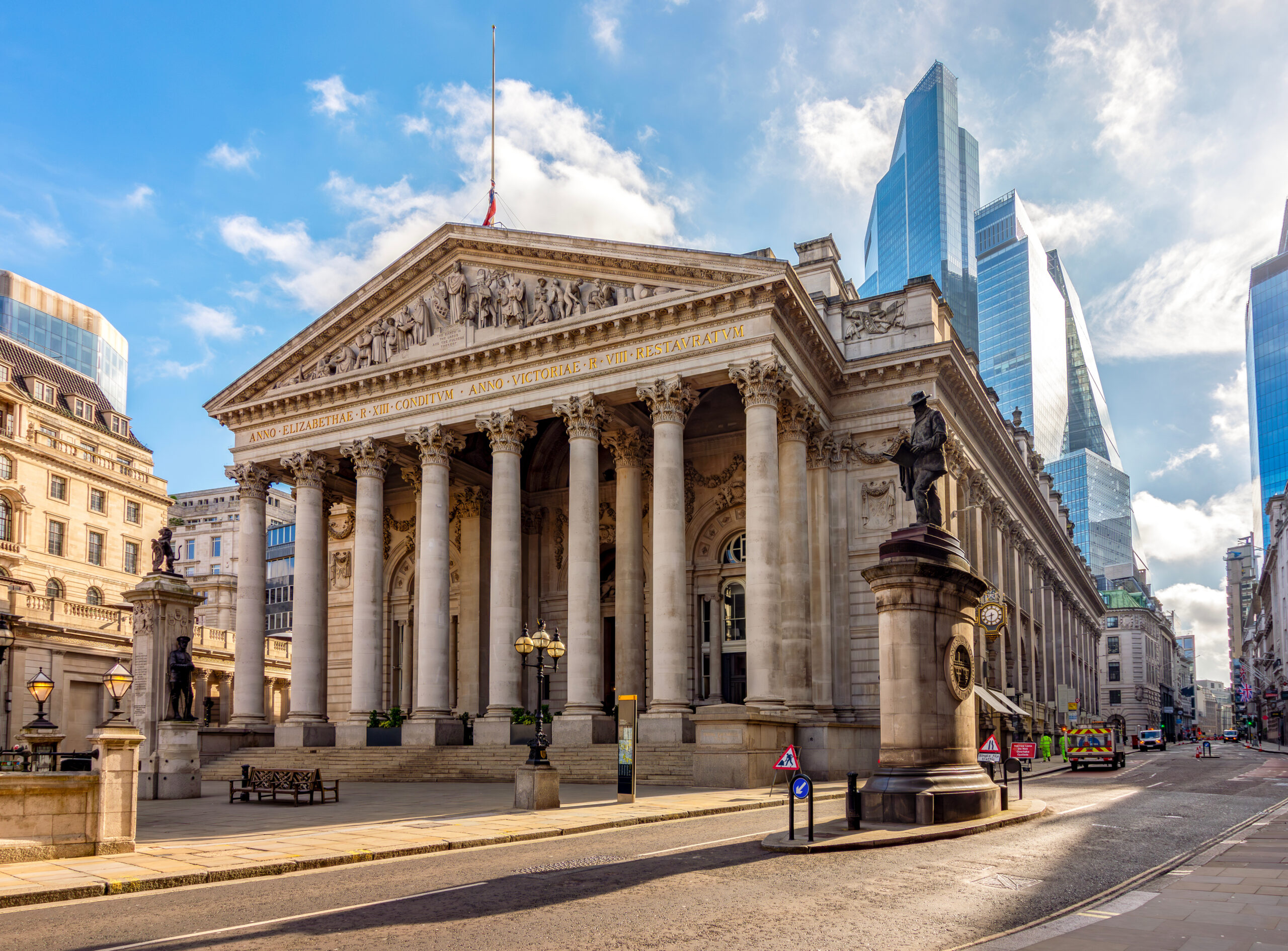 Royal Exchange building in City of London, UK (translation "founded in thirteenth year of Queen Elizabeth, and restored in eighth of Queen Victoria")